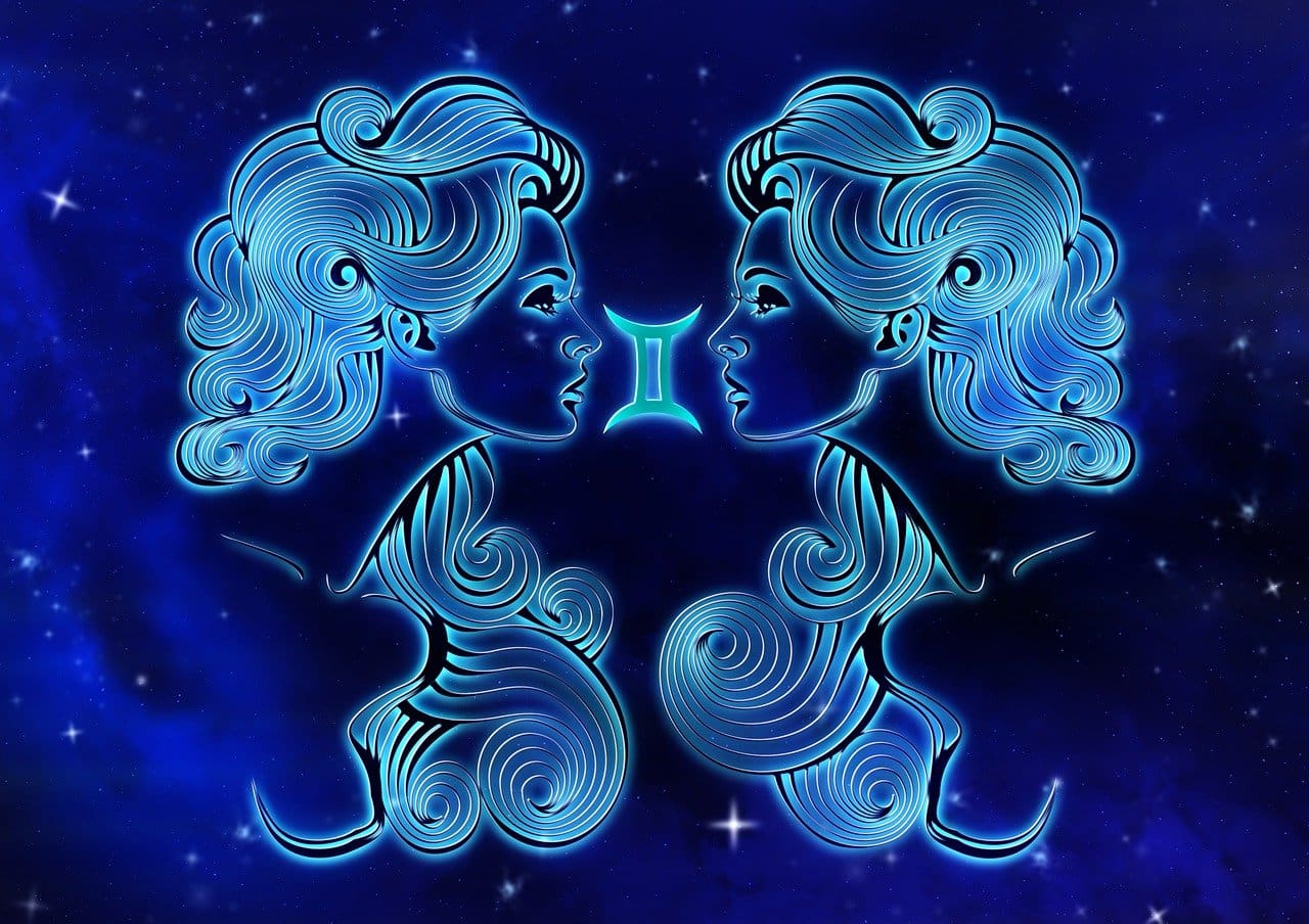 Image of two stylized blue female profiles facing each other, set against a starry background with a glowing Gemini symbol between them, showcasing Cancer zodiac outfits.
