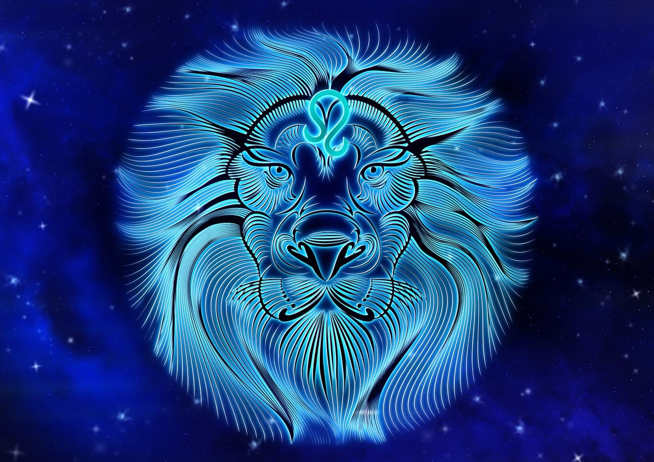 A glowing, stylized lion's head in blue, set against a dark, starry background evokes the mystique of Cancer zodiac outfits. The design features intricate, swirling lines that add to its enchanting allure.